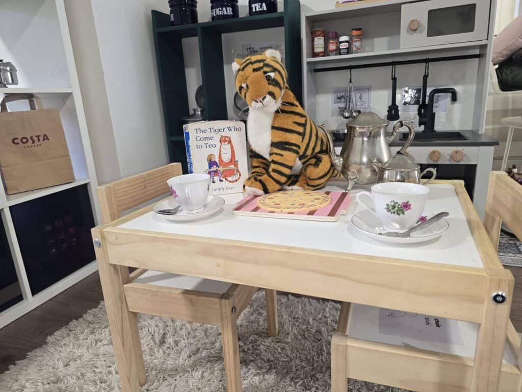nursery key worker role play tea setup supporting imaginative play