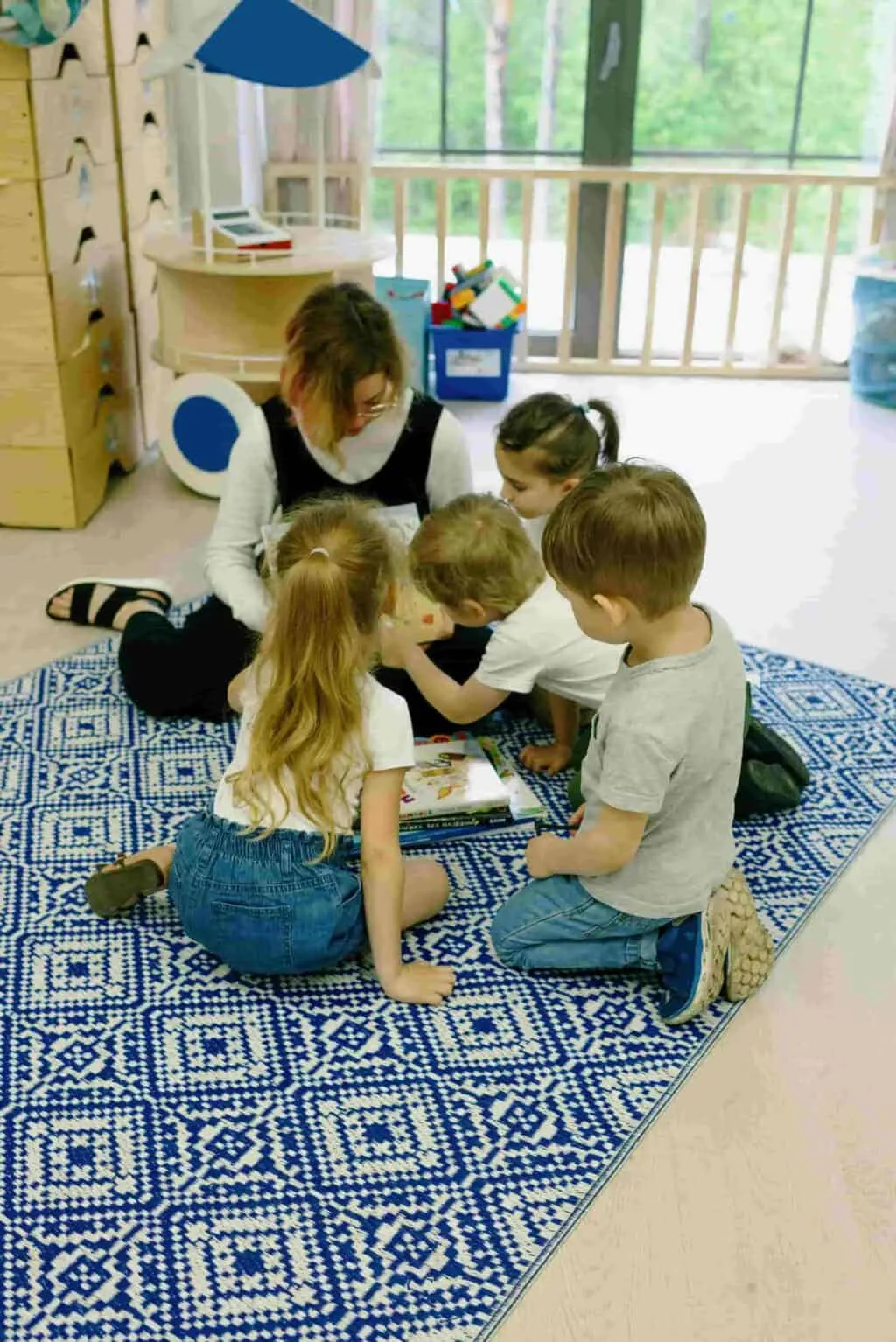 Children taking part in story time activity supporting the revised EYFS framework
