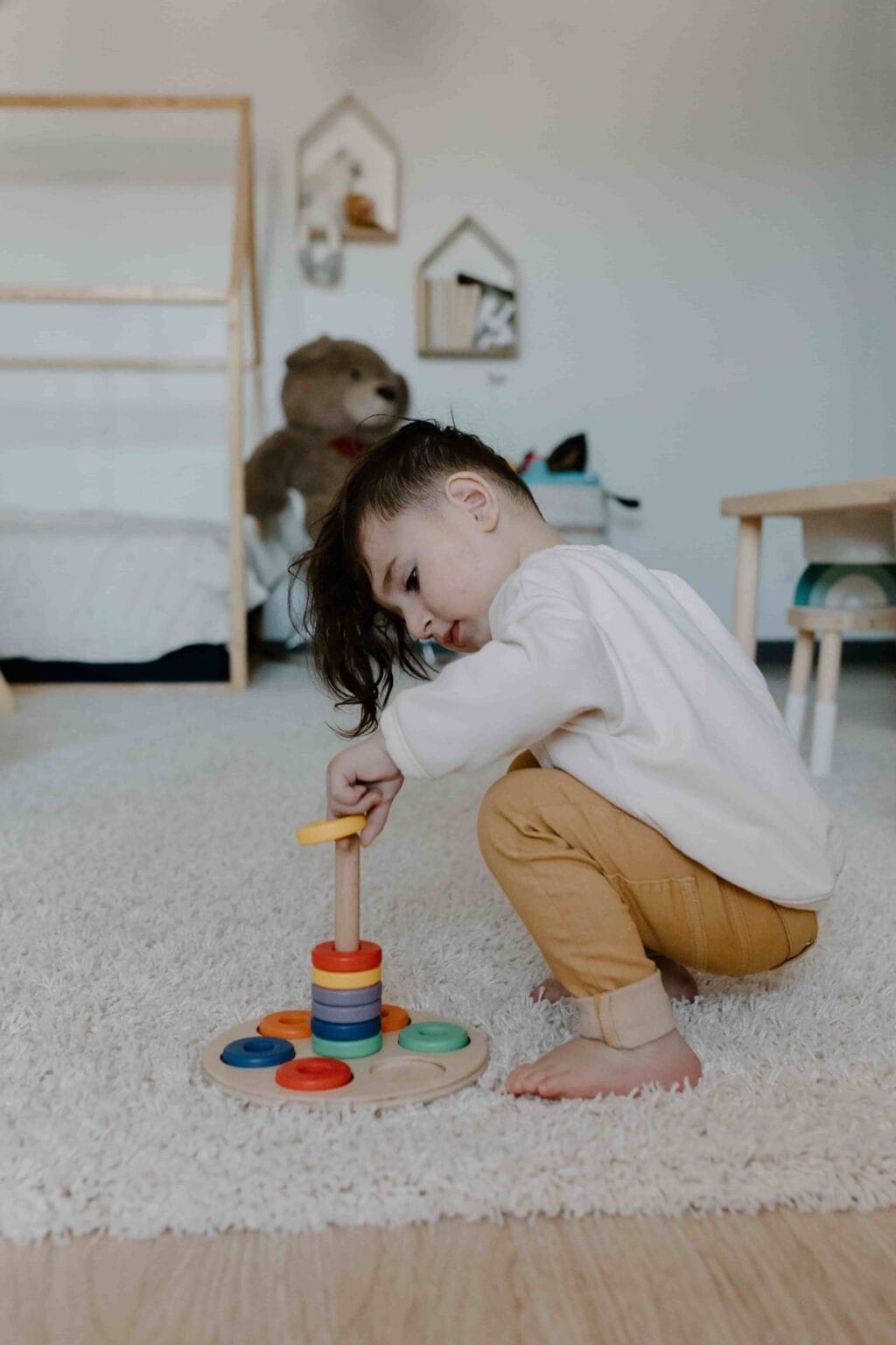 Child developing school readiness skills through independent play and problem-solving