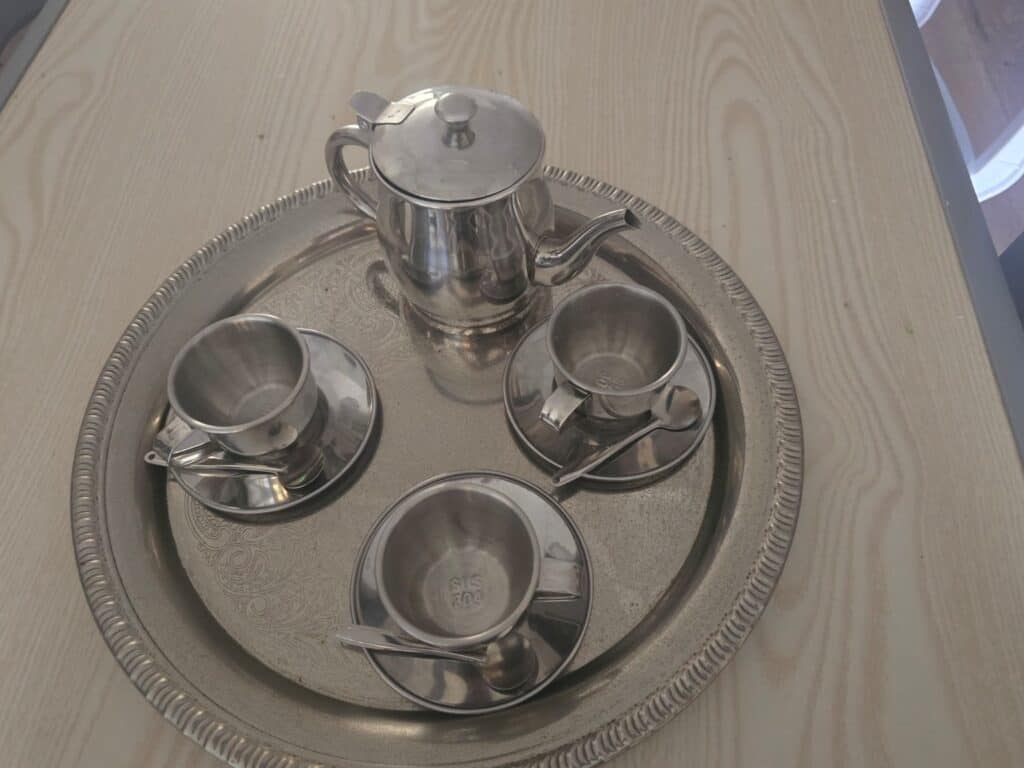 Open-ended play with a real tea set and everyday objects at The Nook Nursery